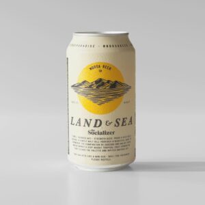 A can of noosa beer from the land & sea brewery labeled "socializer," featuring a yellow and black design with a mountain and sea graphic, placed against a plain white background, perfect for enjoying