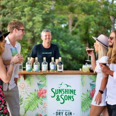A group of people enjoying a private tour at a gin bar on the Sunshine Coast.